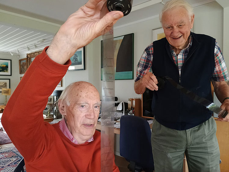 Two men looking at film